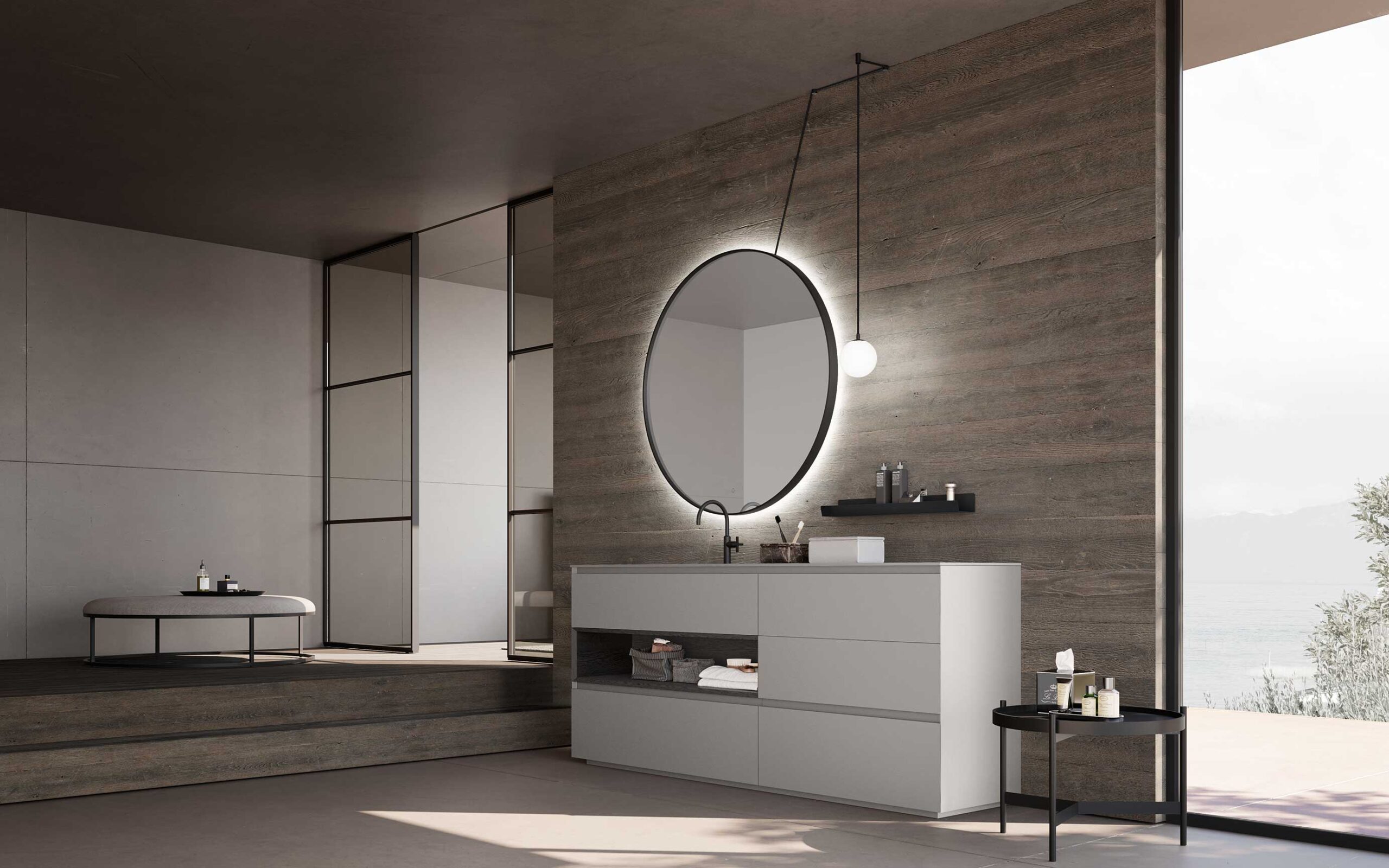 Modern bathroom with Soft-touch Light Grey floor-mounted base units, round backlit mirror with black profile, ceiling lamp and wood-effect wall lamp.