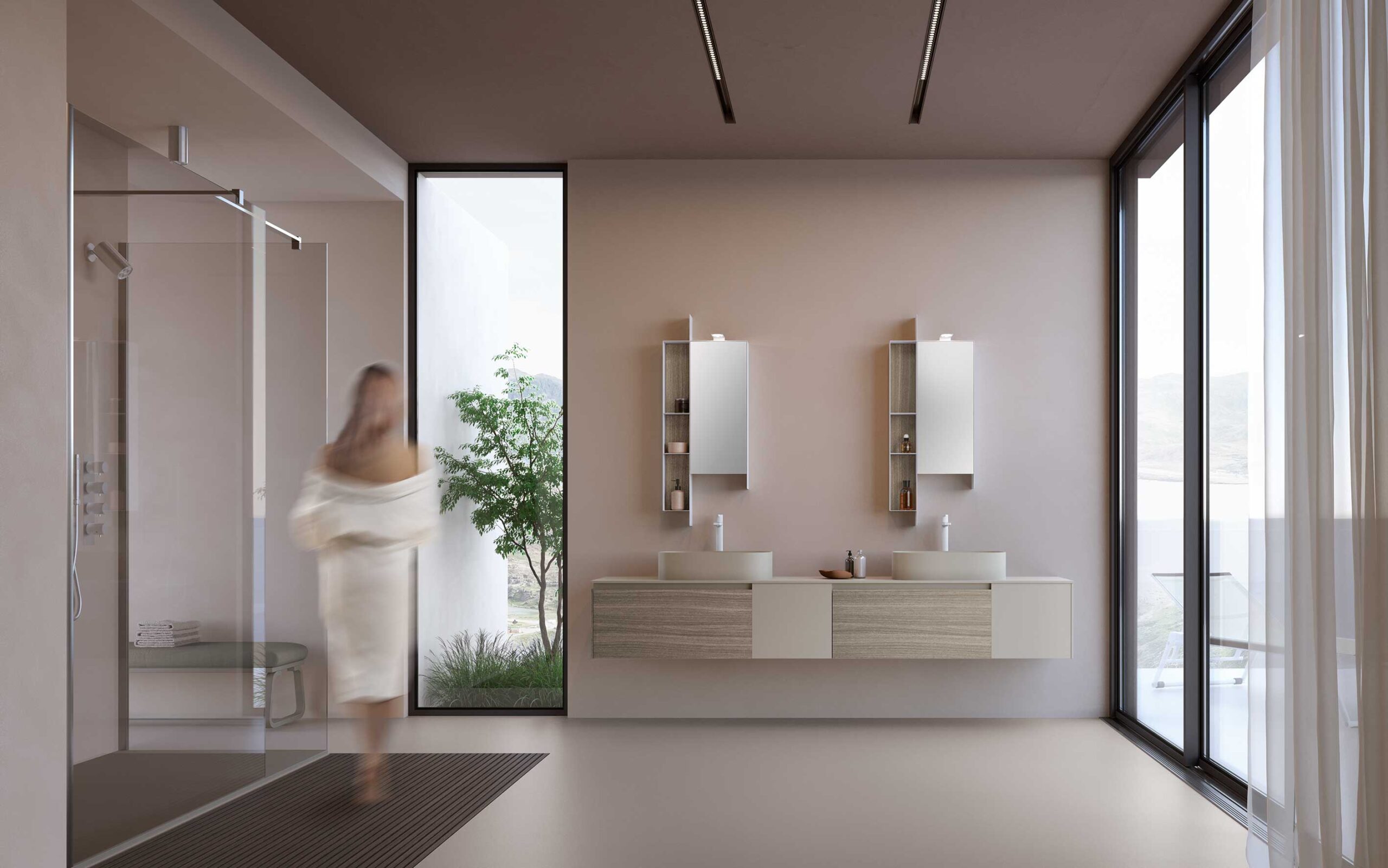 Bagno moderno con doppio lavabo sospeso, ampie vetrate e donna in accappatoio sfocata.