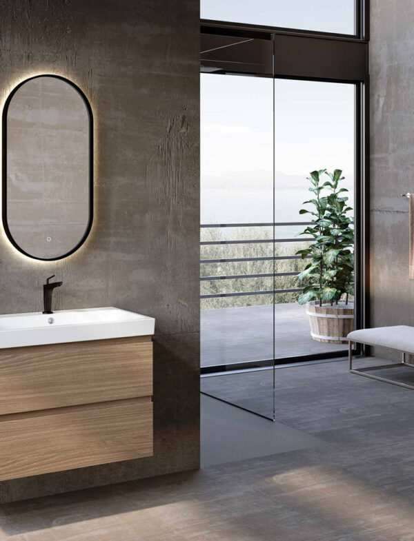 Stanza da bagno con pareti in cemento grezzo.