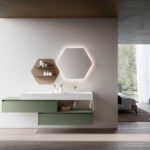 Mobile bagno sospeso verde salvia con doppio cassone, specchio esagonale retroilluminato