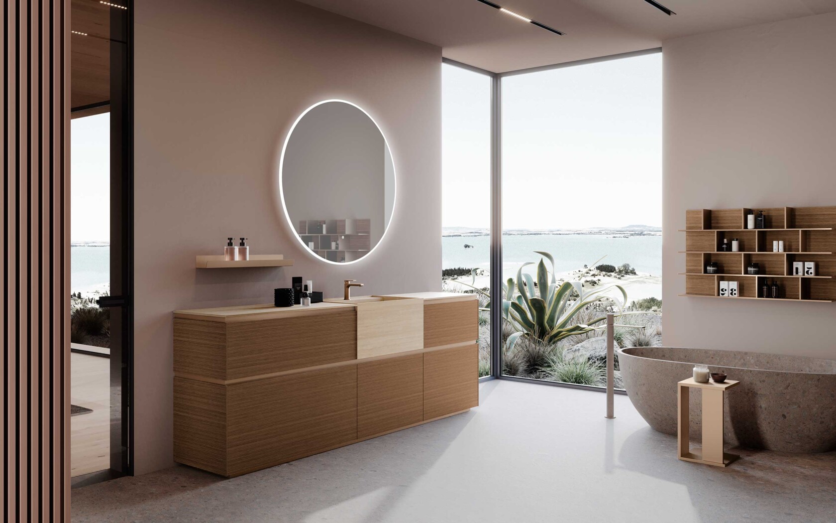 Bagno di design contemporaneo con mobile Azzurra Lime 2.0 in finitura effetto rigatino, lavabo integrato, specchio rotondo retroilluminato, mensola, pensili a giorno a parete e vasca freestanding davanti a una grande vetrata panoramica.